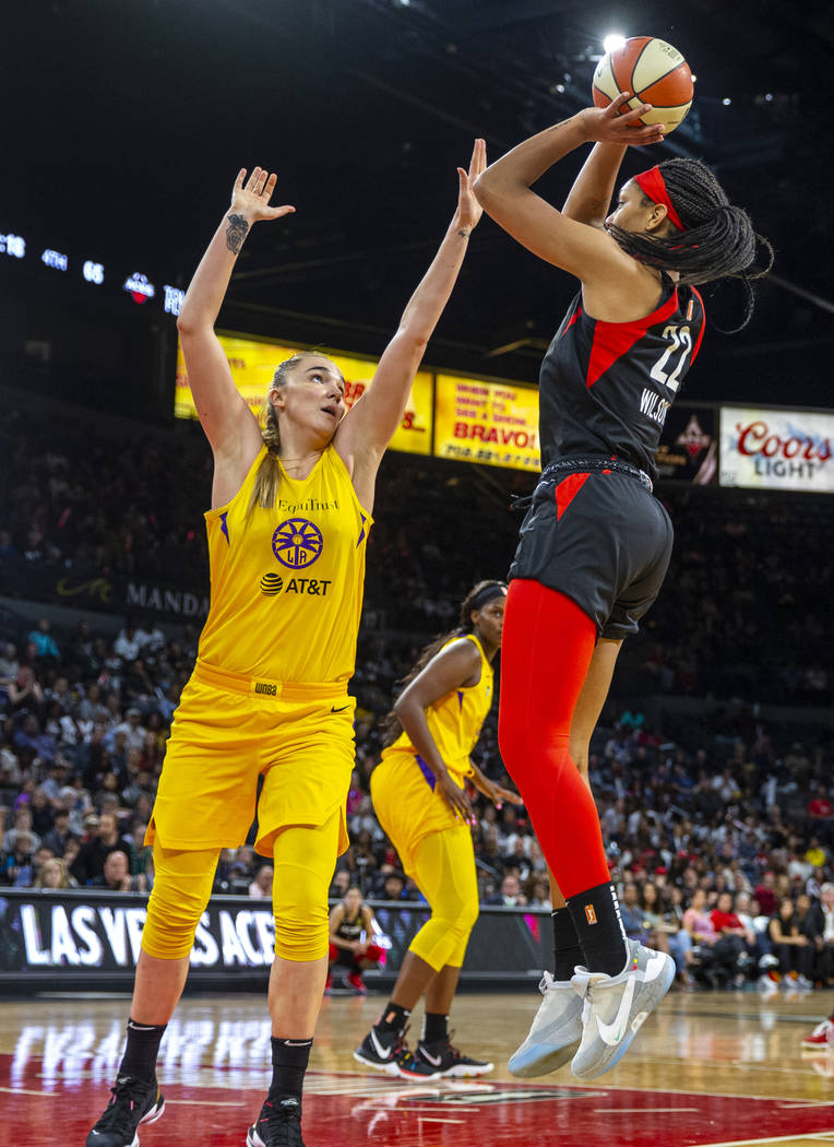 Los Angeles Sparks forward/center Maria Vadeeva (7) attempts to defend a shot by Las Vegas Aces ...