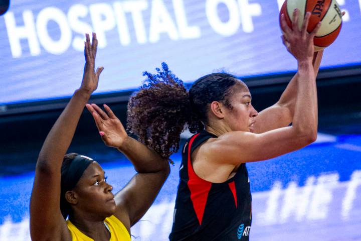 Los Angeles Sparks center Kalani Brown (21) defends the basket from Las Vegas Aces forward Dear ...