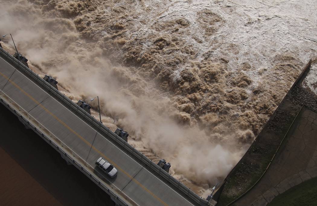 Water is released from the Keystone Dam into the Arkansas River northwest of Tulsa, Okla., Frid ...