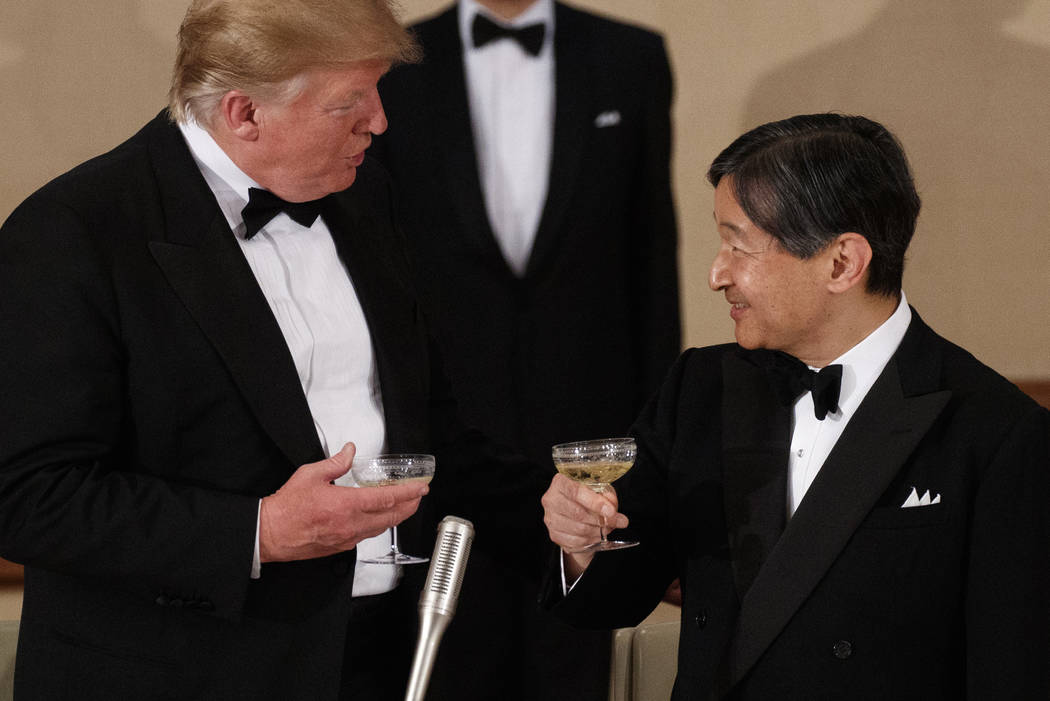 President Donald Trump toasts with Japan's Emperor Naruhito during a State Banquet at the Imper ...