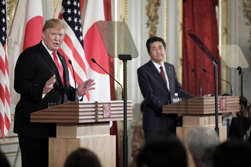 President Donald Trump, left, speaks as Japanese Prime Minister Shinzo Abe listens during a new ...
