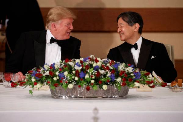 President Donald Trump talks with Japanese Emperor Naruhito during a State Banquet at the Imper ...