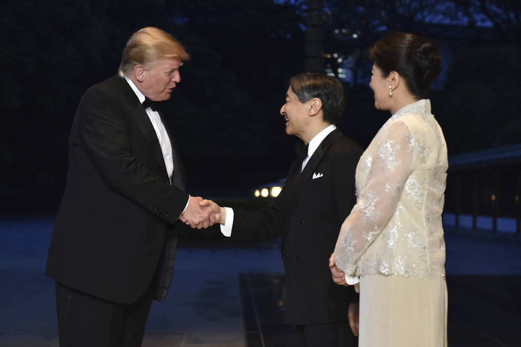 U.S. President Donald Trump is greeted by Japan's Emperor Naruhito, center, and Empress Masako ...