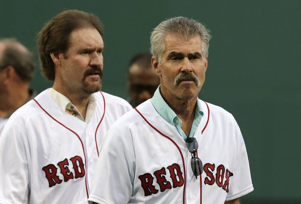Former Boston Red Sox's players Bill Buckner, right, and Wade Boggs prior to a baseball game ag ...