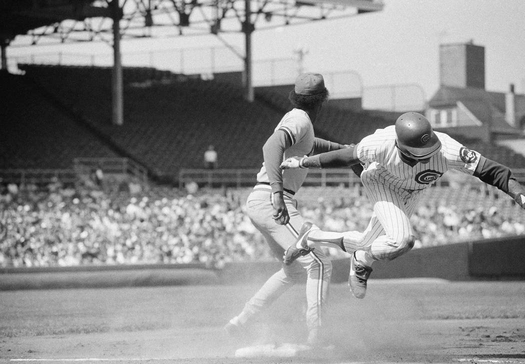 Chicago Cubs Bill Buckner flies over first, stumbling on the base as he was forced out by St. L ...