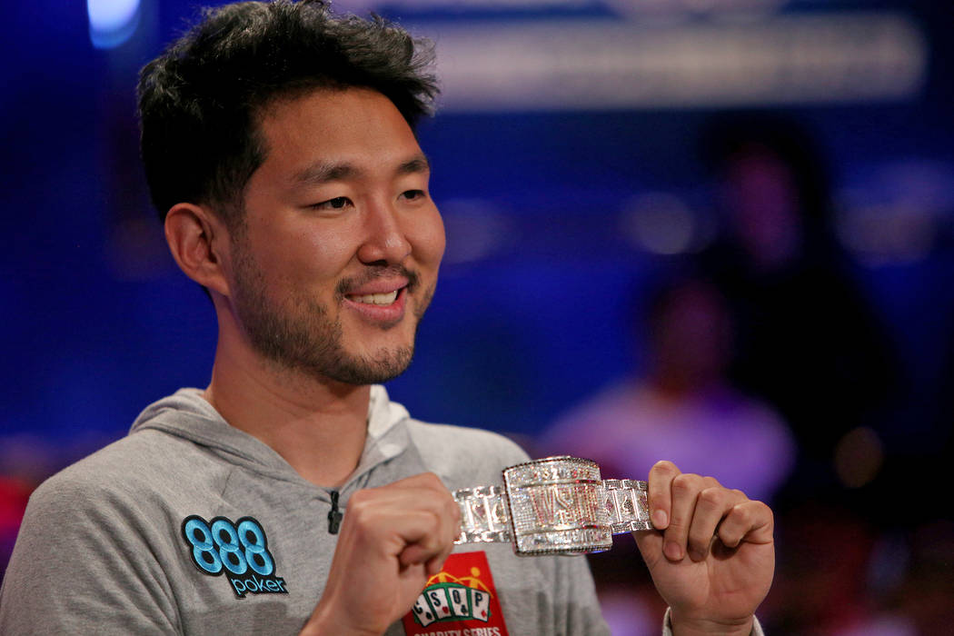 John Cynn holds his gold championship bracelet after winning the World Series of Poker tourname ...