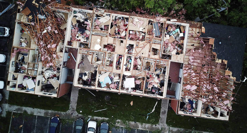 This aerial photo shows tornado damage at the Westbrooke Village Apartment complex in Trotwood, ...