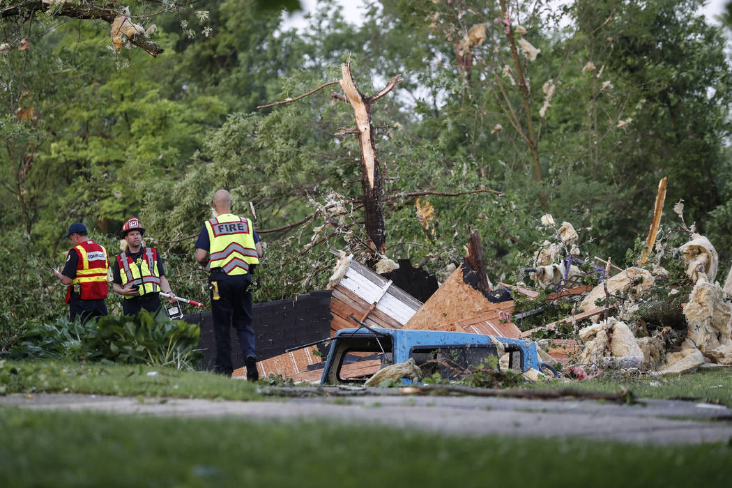 Storm damage liters a residential neighborhood, Tuesday, May 28, 2019, in Vandalia, Ohio. A rap ...