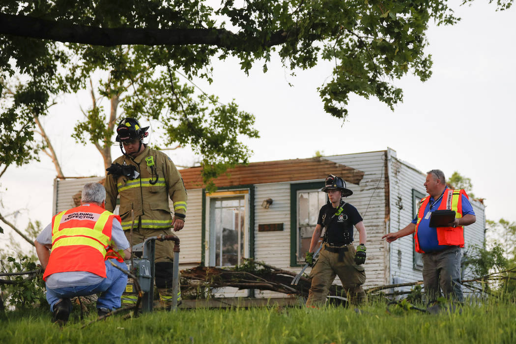 Storm damage litters a residential neighborhood, Tuesday, May 28, 2019, in Vandalia, Ohio. A ra ...