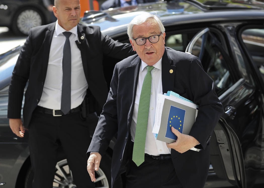 European Commission President Jean-Claude Juncker, right, arrives for a meeting of the European ...