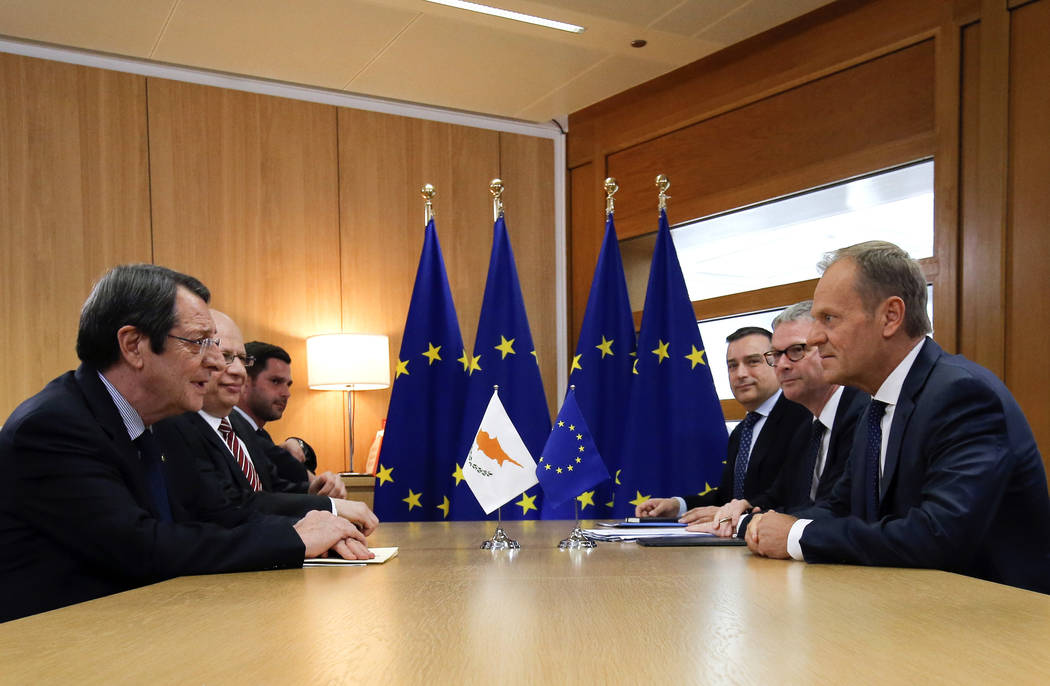 Cypriot President Nicos Anastasiades, left, meets with European Council President Donald Tusk o ...