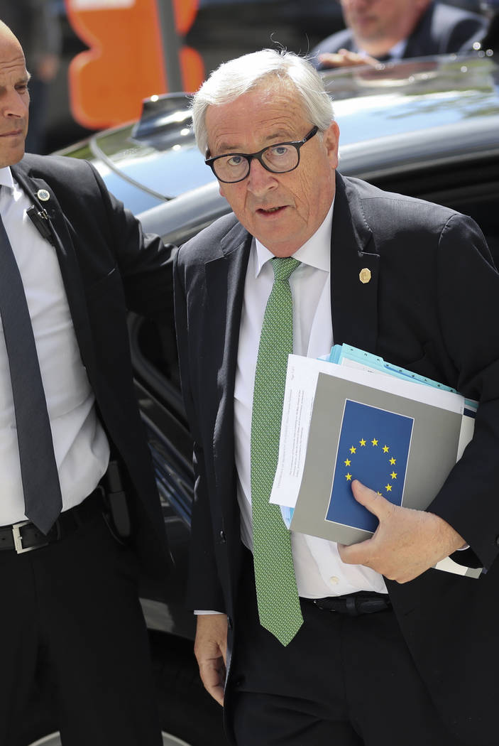 European Commission President Jean-Claude Juncker, right, arrives for a meeting of the European ...