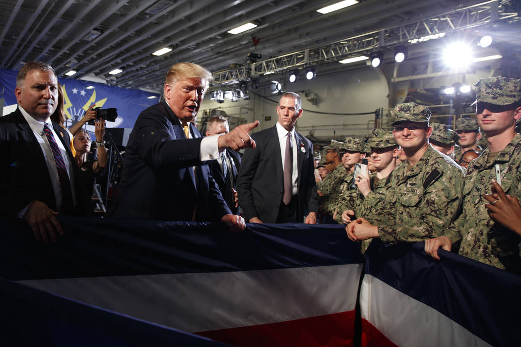 U.S. President Donald Trump talks with troops at a Memorial Day event aboard the USS Waspamphib ...
