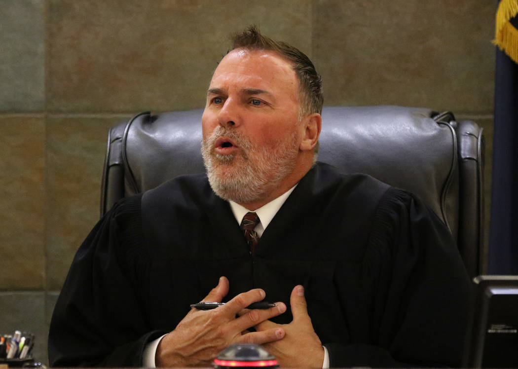 District Judge William Kephart presides during the sentencing of Christopher Sena, convicted of ...