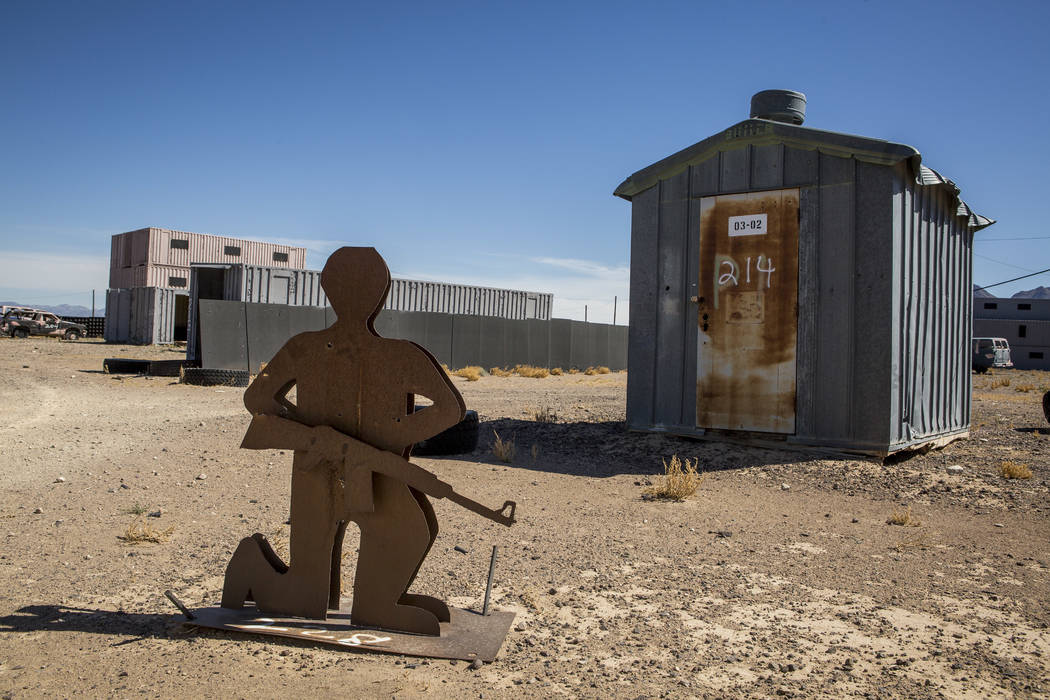 A metal target waits for action in "Gotham City," a mock community made from metal shipping con ...