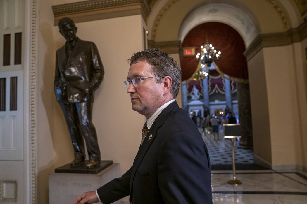 Republican, Rep. Thomas Massie, R-Ky., leaves after speaking to reporters at the Capitol where ...