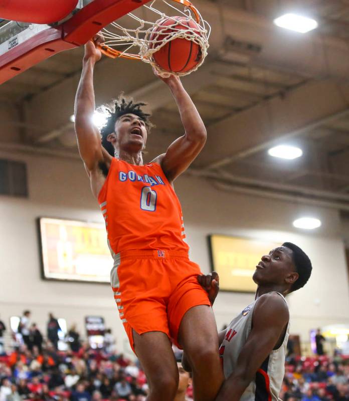 Bishop Gorman's Isaiah Cottrell (0) dunks over Findlay Prep's Alex Tchikou during the first hal ...