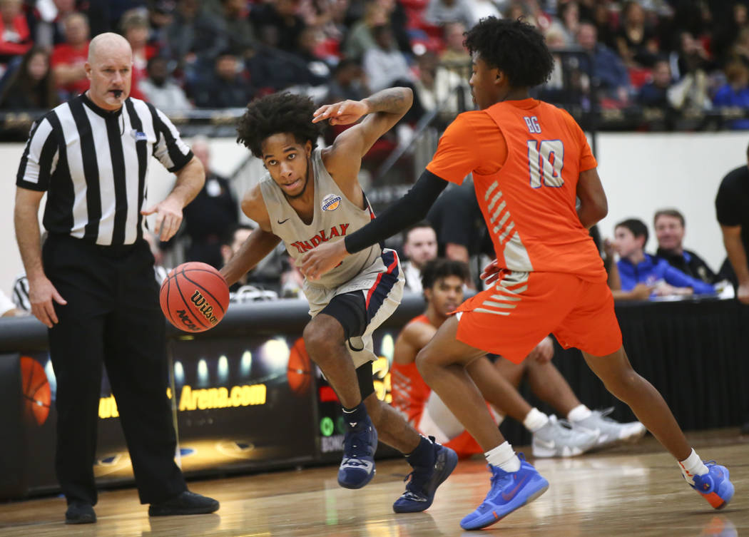 Findlay Prep's P.J. Fuller drives the ball against Bishop Gorman's Zaon Collins (10) during the ...