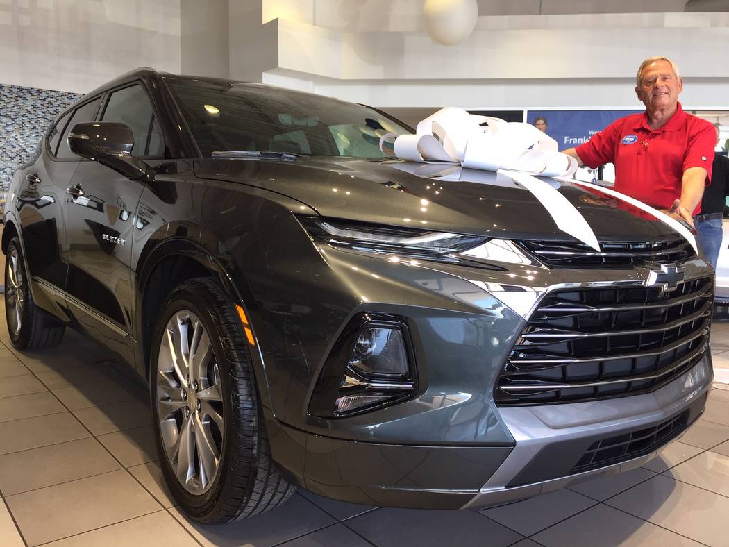 Findlay Chevrolet sales consultant Amos Maly is seen with the 2019 Chevrolet Blazer at the deal ...