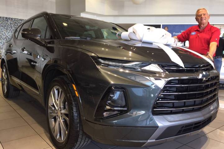 Findlay Chevrolet sales consultant Amos Maly is seen with the 2019 Chevrolet Blazer at the deal ...