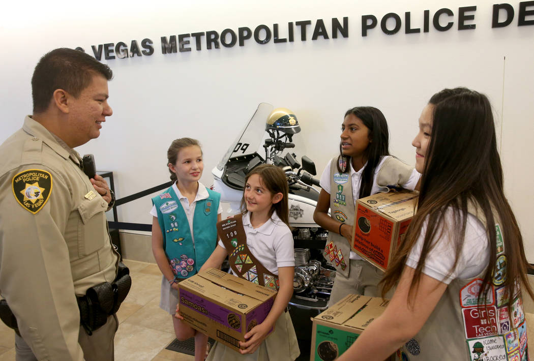 Girl Scouts of Southern Nevada, from left, Kendall Tiffany, 11, Juliette Hoffman, 9, Lily-Renee ...