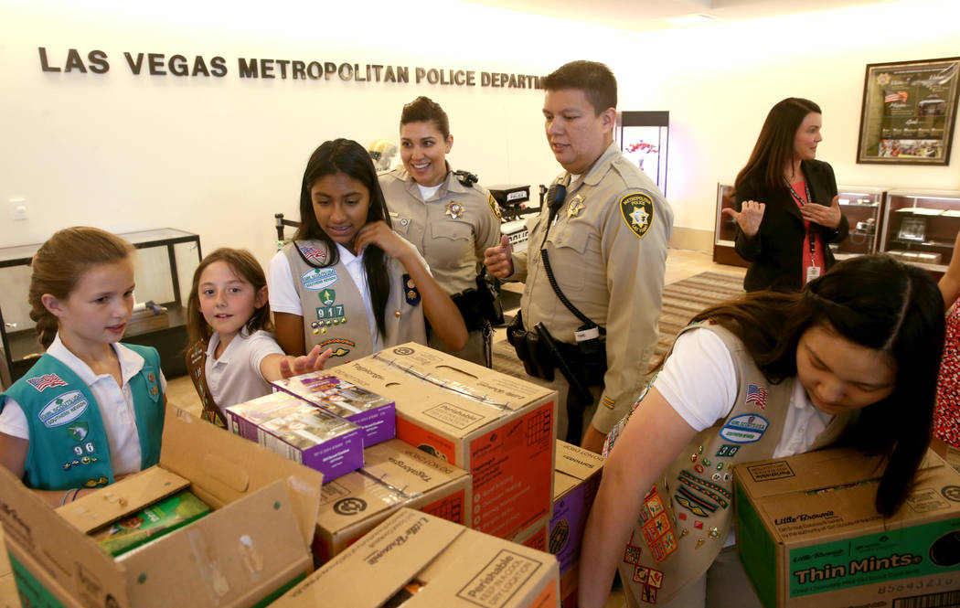 Girl Scouts of Southern Nevada, from left, Kendall Tiffany, 11, Juliette Hoffman, 9, Lily-Renee ...