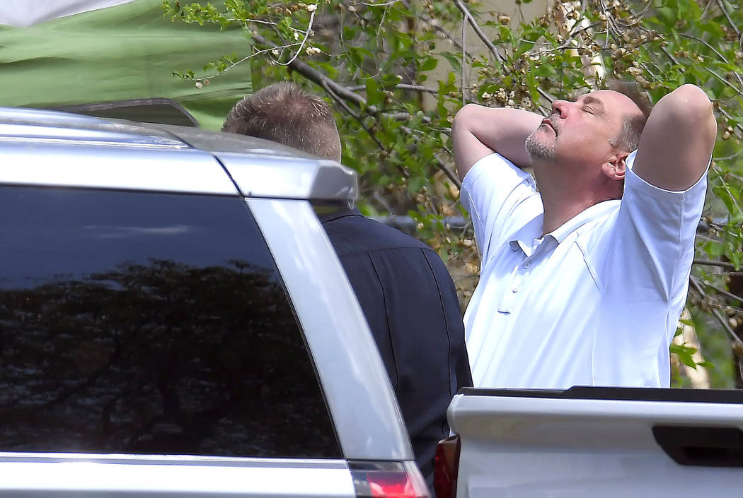 Lt. Rod Peterson puts his hands on his head at the scene where a body that they believe to be E ...