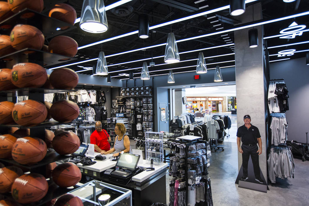 BJ Freeman, left, and Sabrina Freeman, both of Texas, shop at The Raider Image store at the Gal ...