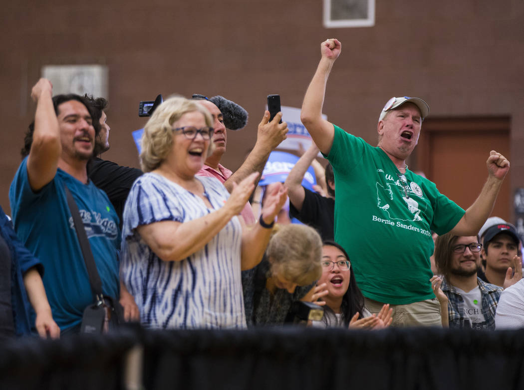 Supporters cheer as Democratic presidential candidate Sen. Bernie Sanders, I-Vt., speaks at a t ...