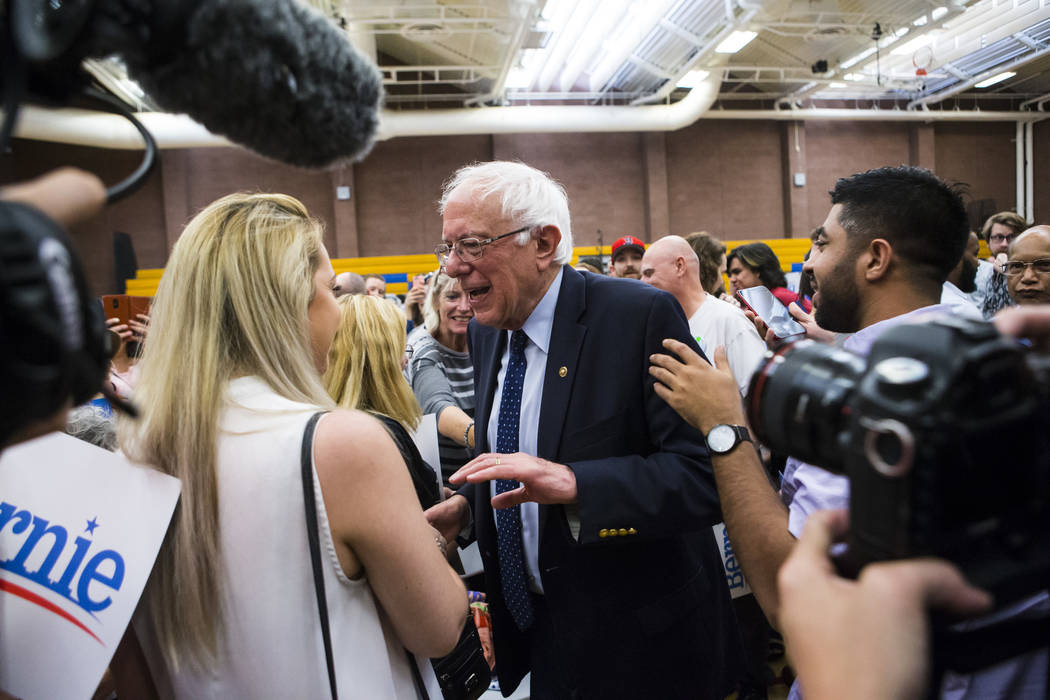 Democratic presidential candidate Sen. Bernie Sanders, I-Vt., greets supporters after a town ha ...