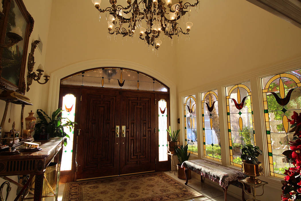 The entry way features stained-glass windows and a large chandelier. (Mt. Charleston Realty)