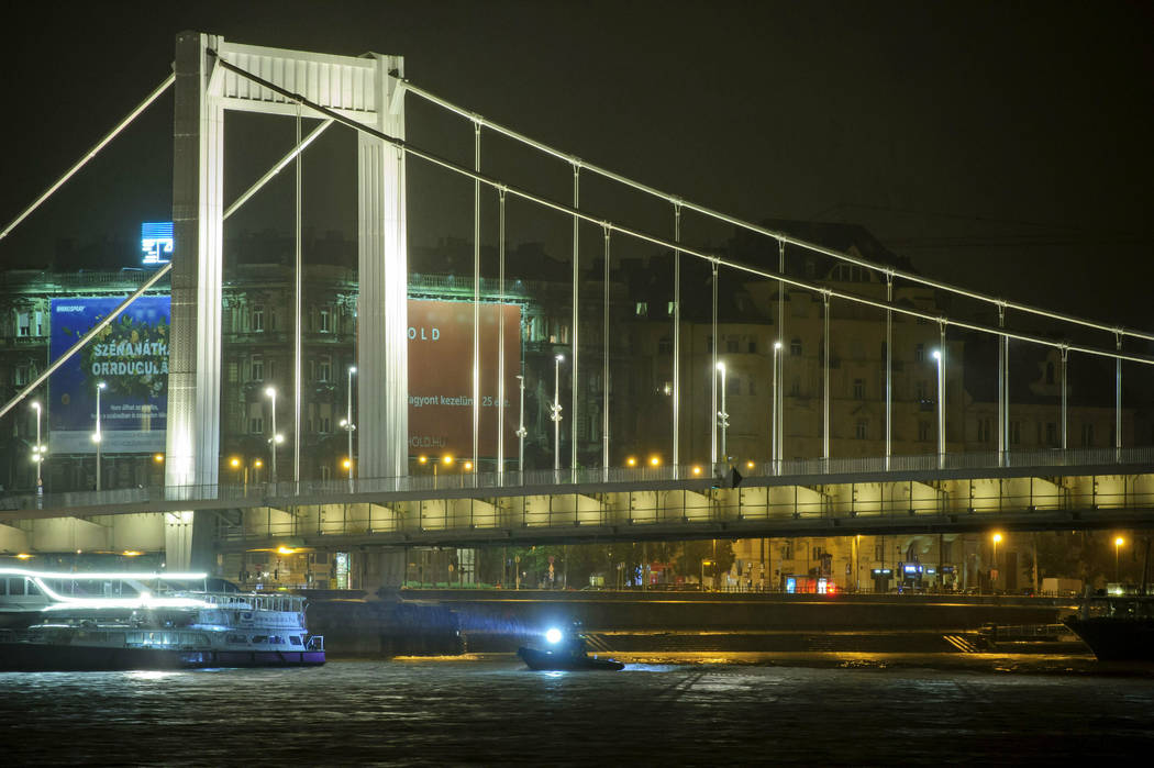 A rescue boat searches for victims late Wednesday, May 29, 2019, after a tourist boat crashed w ...