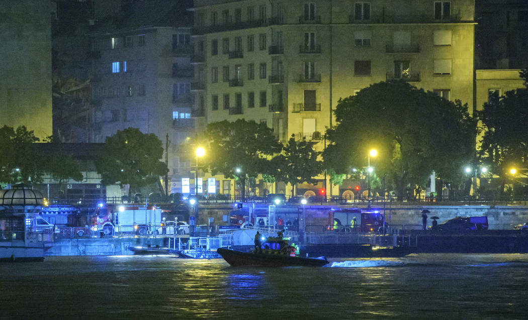 A rescue boat searches for victims late Wednesday, May 29, 2019, after a tourist boat crashed w ...