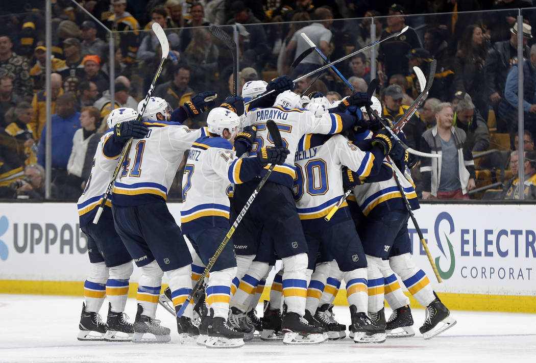 The St. Louis Blues mob Carl Gunnarsson, of Sweden, who scored the winning goal against the Bos ...