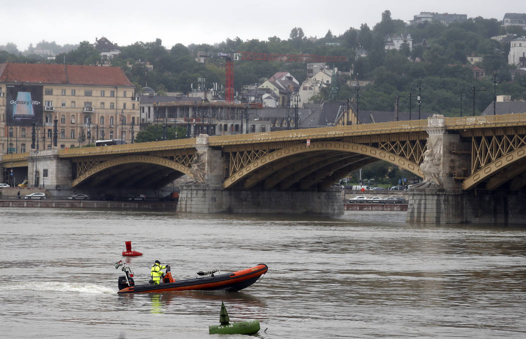 A rescue boat searches for survivors on the River Danube in Budapest, Hungary, Thursday, May 30 ...