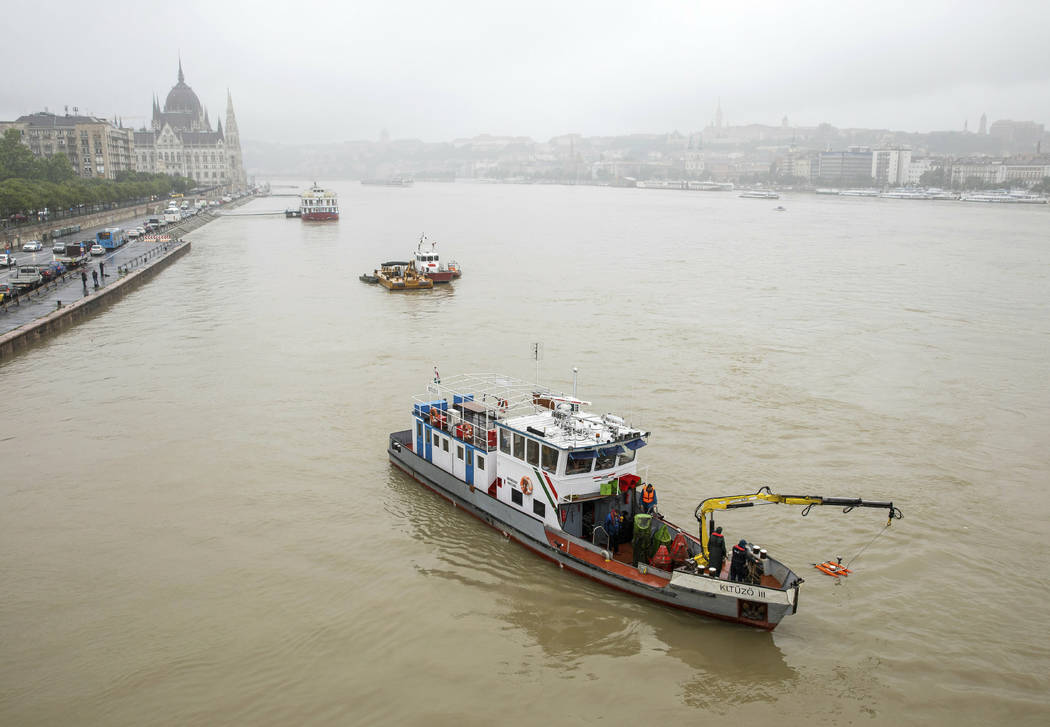 A rescue ship at Margaret Bridge during a search operation on the River Danube in Budapest, Hun ...