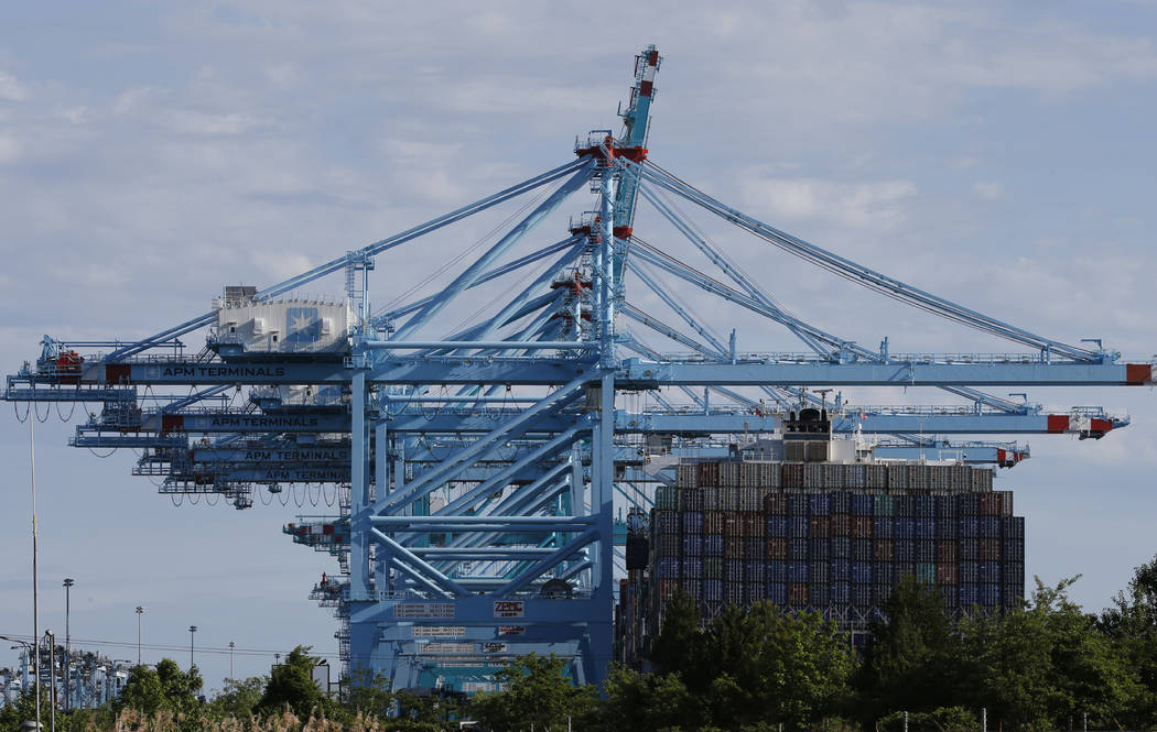 FILE - In this May 10, 2019 file photo a container ship is loaded at the Virginia International ...