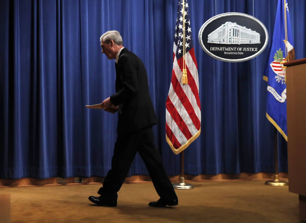 Special counsel Robert Mueller walks from the podium after speaking at the Department of Justic ...