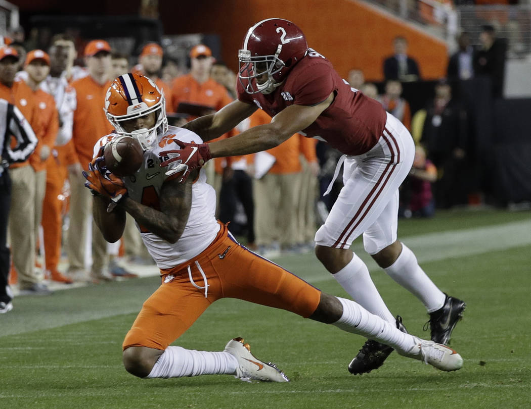Clemson's Diondre Overton catches a pass in front of Alabama's Patrick Surtain II during the se ...