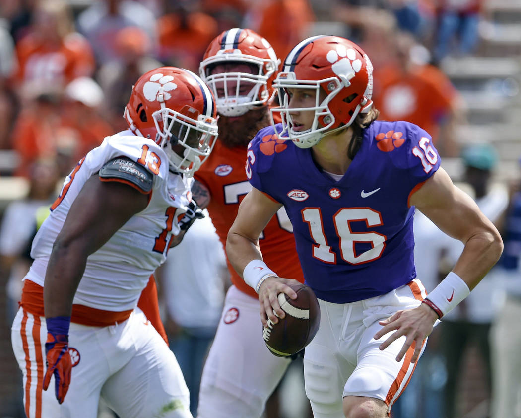 Clemson's Trevor Lawrence (16) scrambles out of the backfield during Clemson's annual Orange an ...