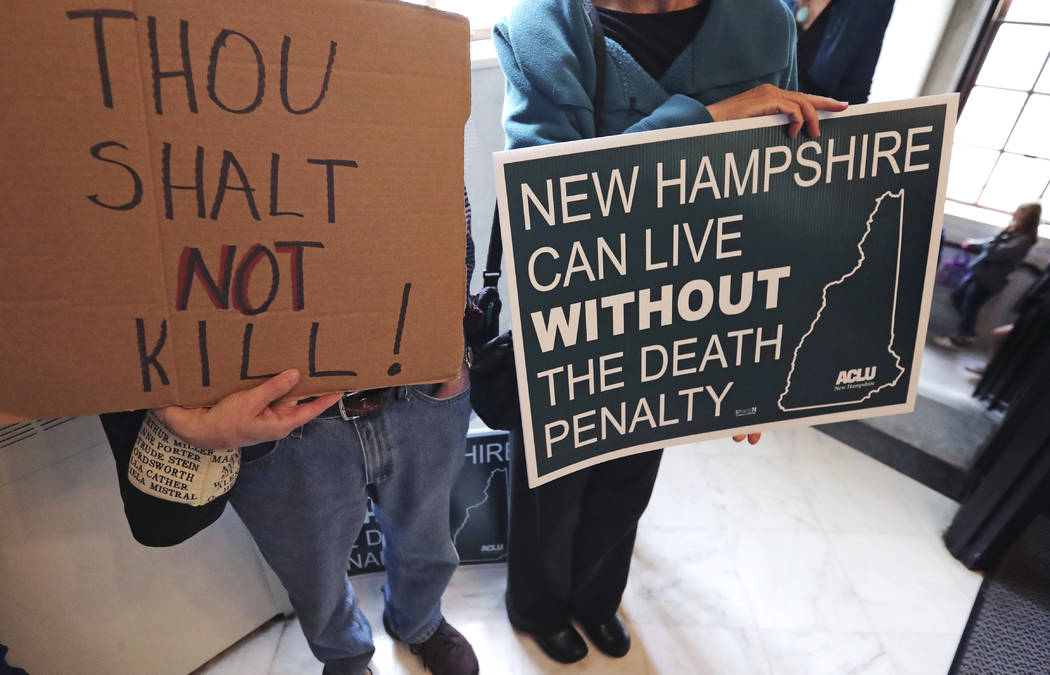 Protestors gather outside the Senate Chamber prior to a vote on the death penalty at the State ...