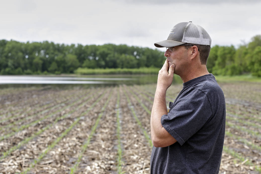 Jeff Jorgenson looks over a partially flooded field May 29, 2019, that he farms near Shenandoah ...