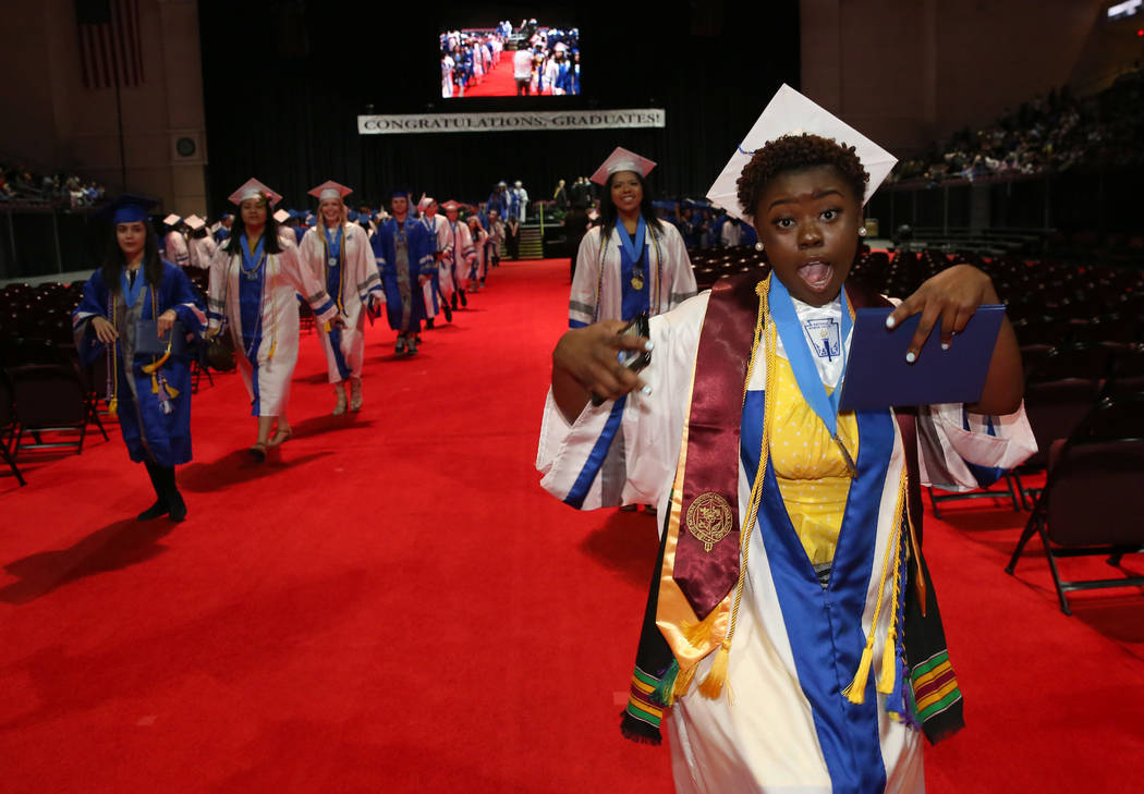 College of Southern Nevada High School student Keyana Webb reacts after receiving her diploma d ...