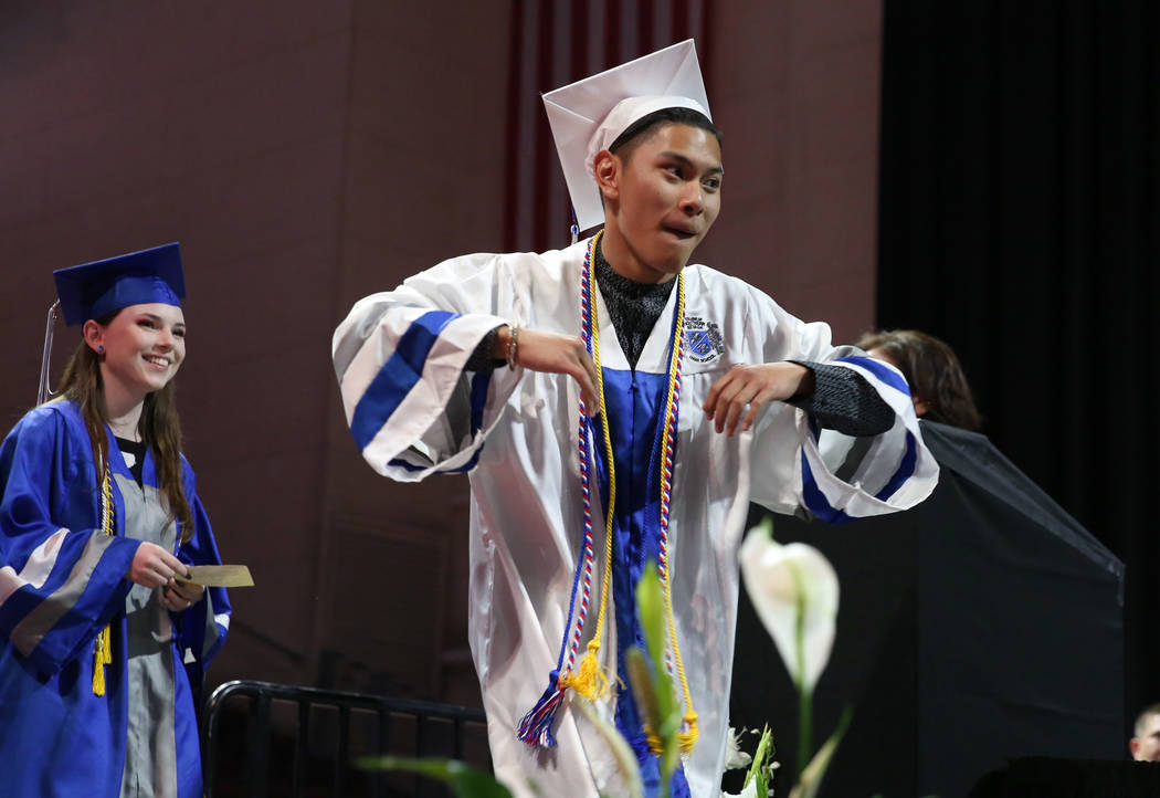 College of Southern Nevada High School student Carl Tiglao reacts as he prepares to receive his ...