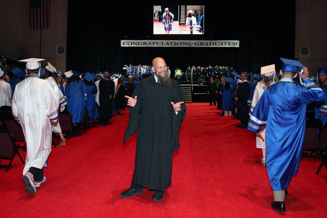 College of Southern Nevada High School principal George Leavens greets his students during CSN' ...