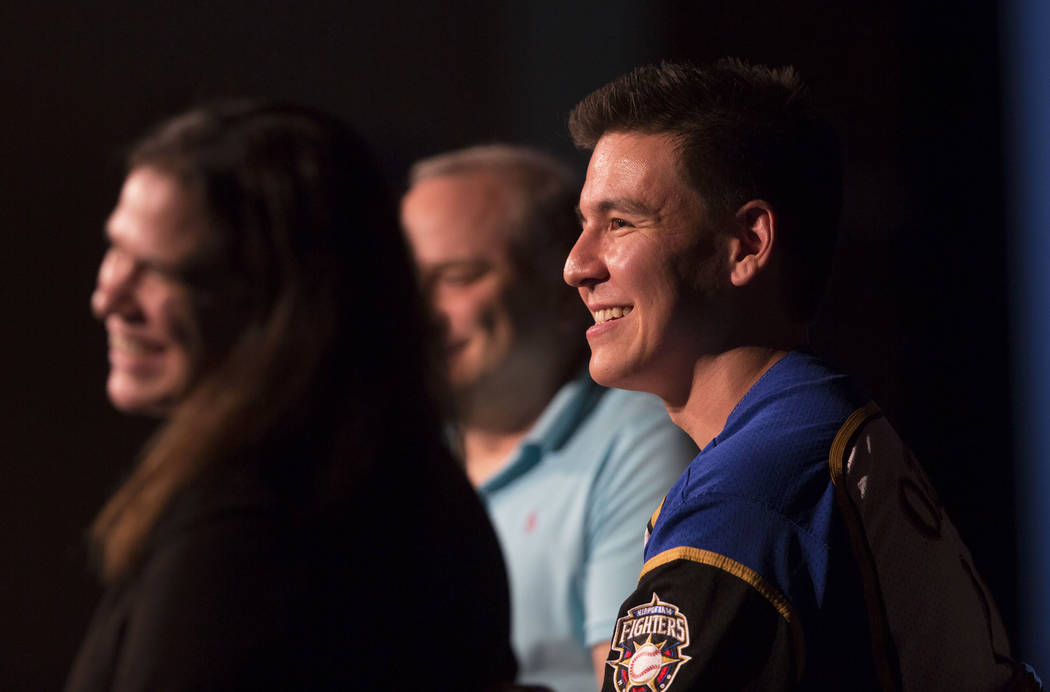 “Jeopardy!” champion James Holzhauer, right, listens to a question from the audience during ...