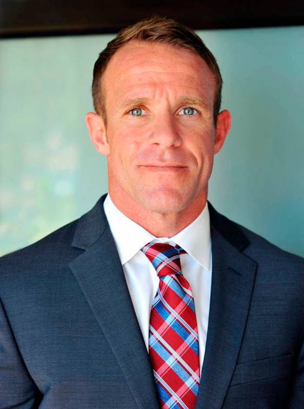 FILE - This 2018 file photo provided by Andrea Gallagher shows her husband, Navy SEAL Edward Ga ...