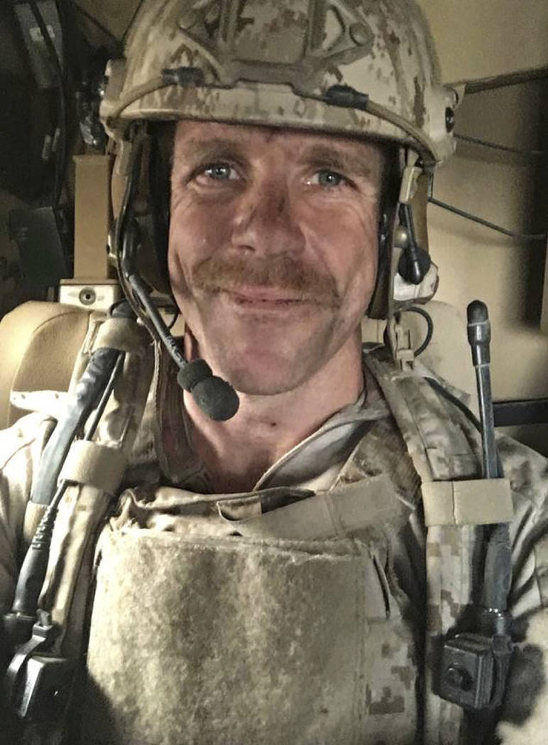 This undated selfie photo provided by Andrea Gallagher shows her husband, Navy SEAL Edward Gall ...