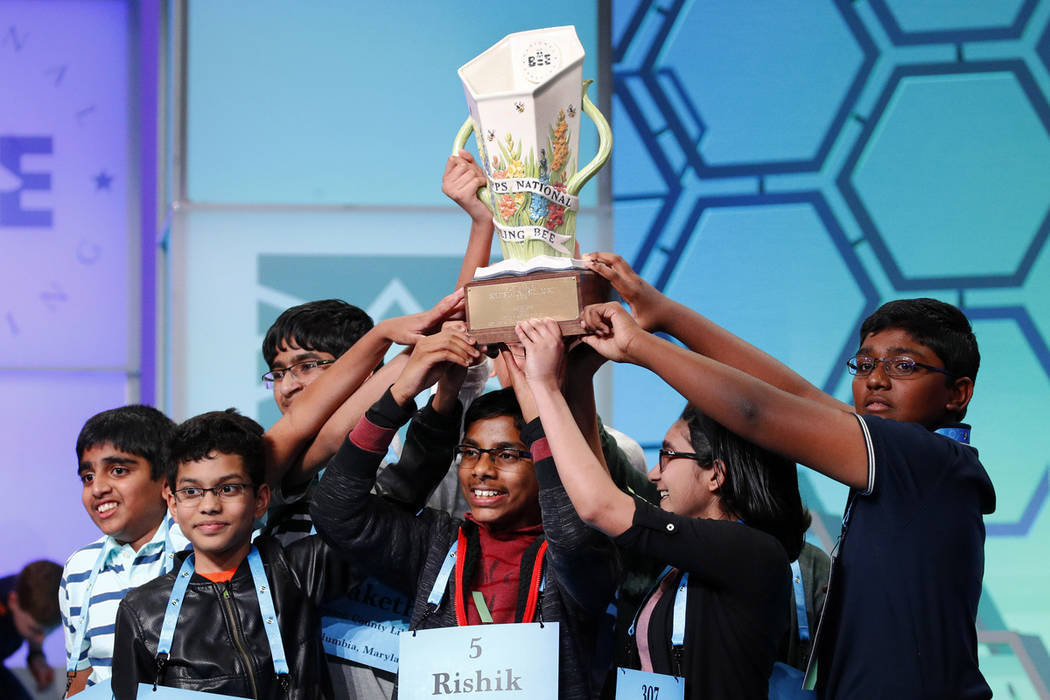 The eight co-champions celebrate after winning the Scripps National Spelling Bee, Friday, May 3 ...