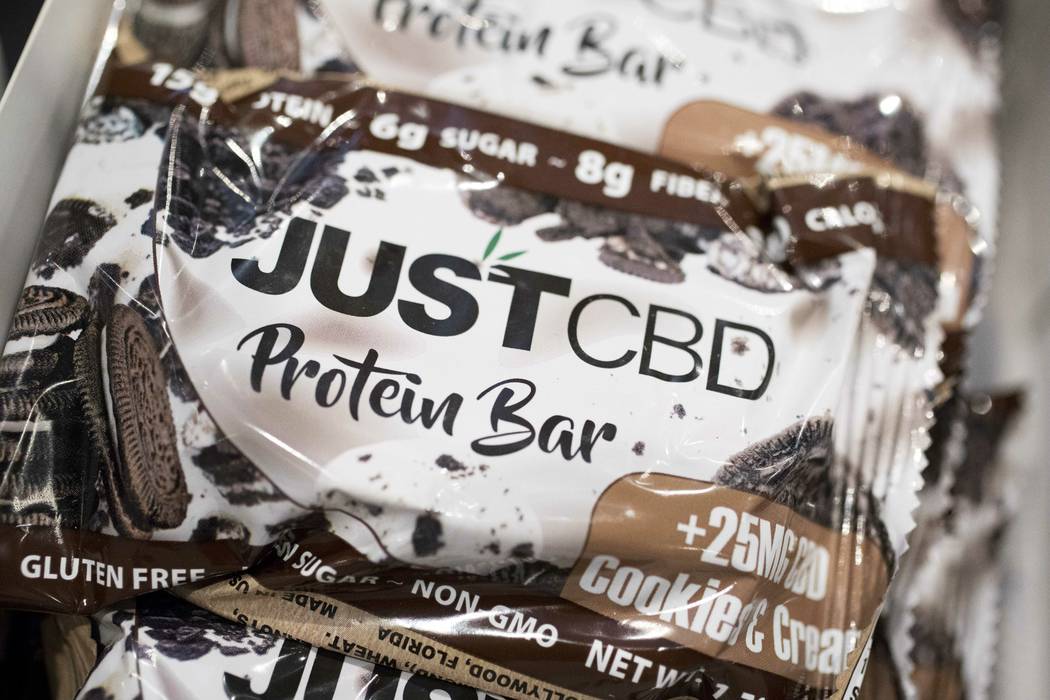 A cookies and cream flavored protein bar marketed by JustCBD is displayed at the Cannabis World ...